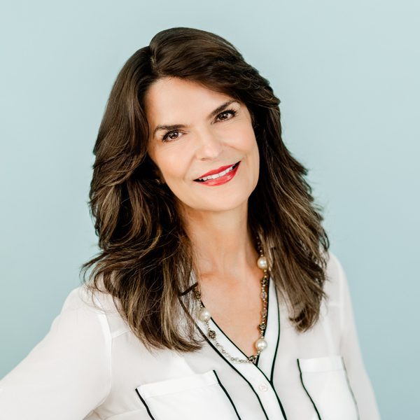 A woman with long hair and wearing white shirt.