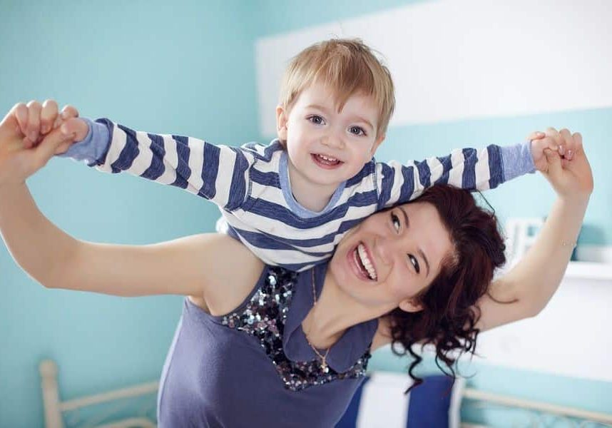 A woman holding a child in her arms.